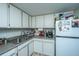Functional kitchen with stainless steel sink, appliances, and ample counter space at 14 Lockwood Dr # 9K, Charleston, SC 29401