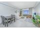 Bright living room featuring modern decor, a large window with city views, and a cozy seating area at 14 Lockwood Dr # 9K, Charleston, SC 29401