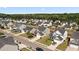 An aerial view features a serene suburban community with neat homes and lush green spaces, embodying peaceful residential living at 144 Marinella Dr, Goose Creek, SC 29445
