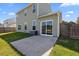 The backyard features a well-maintained yard, concrete patio, and sliding glass doors for easy access to the indoors at 144 Marinella Dr, Goose Creek, SC 29445