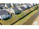 Aerial view of a fenced backyard with green space, located adjacent to a tranquil stream, offering privacy and a natural ambiance at 144 Marinella Dr, Goose Creek, SC 29445
