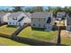 Aerial view of a fenced backyard providing a secure outdoor space perfect for recreation, next to a home with sliding glass doors at 144 Marinella Dr, Goose Creek, SC 29445