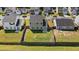 Aerial view of a fenced backyard with green grass, perfect for outdoor activities and relaxation in a suburban setting at 144 Marinella Dr, Goose Creek, SC 29445