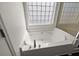 Close up on the large white bathtub located in the main bathroom at 144 Marinella Dr, Goose Creek, SC 29445