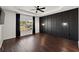 Spacious main bedroom with wood floors, custom accent wall, and stylish ceiling fan at 144 Marinella Dr, Goose Creek, SC 29445
