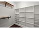Well-organized walk-in closet features custom shelving and hanging rods, providing ample storage space at 144 Marinella Dr, Goose Creek, SC 29445