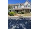 Charming townhome features a well-manicured front yard with lush landscaping at 145 Taylor Cir, Goose Creek, SC 29445