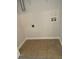 Tiled laundry area with connections for washer and dryer and an access panel at 145 Taylor Cir, Goose Creek, SC 29445