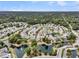 Aerial view of a residential community with single Gathering homes, ponds, and lush greenery at 1472 Longspur Dr, Mount Pleasant, SC 29466