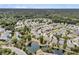 Aerial view of a residential community featuring homes, ponds, and lush greenery, showcasing the community's layout at 1472 Longspur Dr, Mount Pleasant, SC 29466