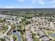 An aerial view of a residential community, featuring winding roads, mature trees, and picturesque ponds at 1472 Longspur Dr, Mount Pleasant, SC 29466