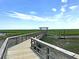 Elevated boardwalk with covered shelter, providing an unobstructed view of the surrounding marshland landscape at 1472 Longspur Dr, Mount Pleasant, SC 29466