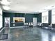 Spacious event room with a kitchenette, tables, chairs, and access to an adjacent space with additional seating at 1472 Longspur Dr, Mount Pleasant, SC 29466