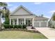 Charming single-Gathering home with a landscaped front yard and two-car garage, offering curb appeal at 1472 Longspur Dr, Mount Pleasant, SC 29466