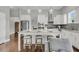 Bright kitchen features a large island with seating, stainless steel appliances, and modern lighting at 1472 Longspur Dr, Mount Pleasant, SC 29466