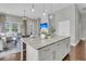 Kitchen island with granite counters overlooking living area with natural light at 1472 Longspur Dr, Mount Pleasant, SC 29466