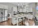 Modern kitchen features granite countertops, stainless steel appliances, and a center island with seating at 1472 Longspur Dr, Mount Pleasant, SC 29466