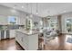 Bright living space with a kitchen island and an inviting living room with large windows at 1472 Longspur Dr, Mount Pleasant, SC 29466