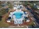 Aerial view of a pool and clubhouse featuring ample seating, manicured landscape, and parking at 1472 Longspur Dr, Mount Pleasant, SC 29466