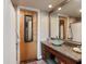 Bathroom featuring a unique glass bowl sink, granite countertop, and stylish mirror at 150 Bee St # 507, Charleston, SC 29401