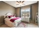 Cozy bedroom with a large window with plenty of natural light, featuring an inviting bed with colorful pillows at 150 Bee St # 507, Charleston, SC 29401