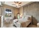 Bedroom with a full sized bed, desk, ceiling fan, and view of the city at 150 Bee St # 507, Charleston, SC 29401
