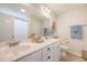 This bathroom features a double vanity, ample countertop space, and a shower and tub combo for convenience at 152 Kirkland St, Goose Creek, SC 29445
