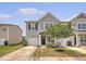 Charming two-story home with gray siding, well-manicured lawn, and an attached one car garage at 152 Kirkland St, Goose Creek, SC 29445