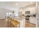 Bright kitchen with white cabinets, stainless steel appliances, granite countertops, and a breakfast bar at 152 Kirkland St, Goose Creek, SC 29445