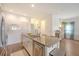 Bright kitchen with granite countertops, stainless steel appliances, and wooden floors at 152 Kirkland St, Goose Creek, SC 29445