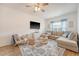 Bright living room with sectional sofa, area rug, and lots of natural light at 152 Kirkland St, Goose Creek, SC 29445