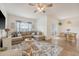 Spacious living room with comfortable sectional sofa, large rug, and view to dining area at 152 Kirkland St, Goose Creek, SC 29445