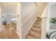 Carpeted stairway leading to the upper level with views of the kitchen and living area at 152 Kirkland St, Goose Creek, SC 29445
