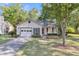 Charming one-story home with a garage, front porch, and well-maintained lawn at 153 Corsair St, Summerville, SC 29483