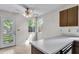 Cozy kitchen area featuring a ceiling fan, backyard view, and a practical countertop at 153 Corsair St, Summerville, SC 29483