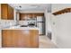 Practical kitchen layout with stainless steel refrigerator and wooden cabinets at 153 Corsair St, Summerville, SC 29483