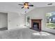 Cozy living room with a brick fireplace and large windows at 153 Corsair St, Summerville, SC 29483