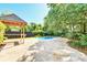 Private backyard oasis featuring a sparkling pool, gazebo, and paved patio area at 1541 Diamond Blvd, Mount Pleasant, SC 29466