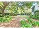 Lush backyard with mature trees and privacy fencing, offering a serene retreat at 1541 Diamond Blvd, Mount Pleasant, SC 29466