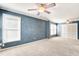 Spacious bedroom featuring large windows, neutral carpet, and a ceiling fan at 1541 Diamond Blvd, Mount Pleasant, SC 29466