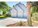Two-story house featuring three-car garage with driveway and landscaped yard at 1541 Diamond Blvd, Mount Pleasant, SC 29466