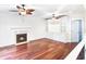 Open living room with a fireplace, built-in shelving, hardwood floors, and great natural light at 1541 Diamond Blvd, Mount Pleasant, SC 29466