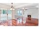 Cozy living room with hardwood floors featuring sliding glass doors to patio and access to kitchen at 1541 Diamond Blvd, Mount Pleasant, SC 29466