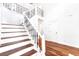 Elegant staircase featuring wood treads, a decorative railing, and an open, airy design at 1541 Diamond Blvd, Mount Pleasant, SC 29466