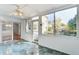 Relaxing sunroom with sliding door access, tiled floor, and backyard views at 1541 Diamond Blvd, Mount Pleasant, SC 29466
