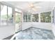 Inviting sunroom featuring tiled floors, a ceiling fan, and access to the outdoors at 1541 Diamond Blvd, Mount Pleasant, SC 29466