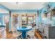 Cozy dining area boasts an ocean view and a quaint blue dining table with charming decor at 1619 Live Oak Park, Johns Island, SC 29455