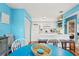 Bright dining area with bar top overlooking modern white kitchen and stainless appliances at 1619 Live Oak Park, Johns Island, SC 29455