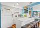 Bright kitchen with white cabinets, stainless steel appliances, and bar-style seating at 1619 Live Oak Park, Johns Island, SC 29455