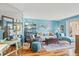Comfortable living room featuring bright blue walls, hardwood flooring, and stylish decor at 1619 Live Oak Park, Johns Island, SC 29455